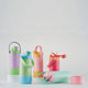 Avanti yum yum 2 way insulated drink bottle. Set of colorful water bottles with different designs on a light gray background