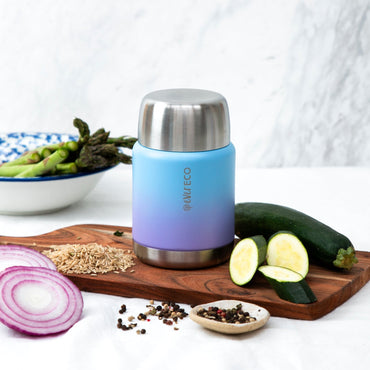 Ever Eco Balance Insulated Food Jar thermos with silver lid on a wooden cutting board with vegetables.