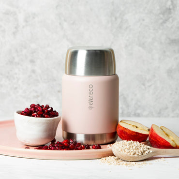 Ever Eco Rose Insulated Food Jar with silver lid on a wooden tray with berries, apples, and oats.