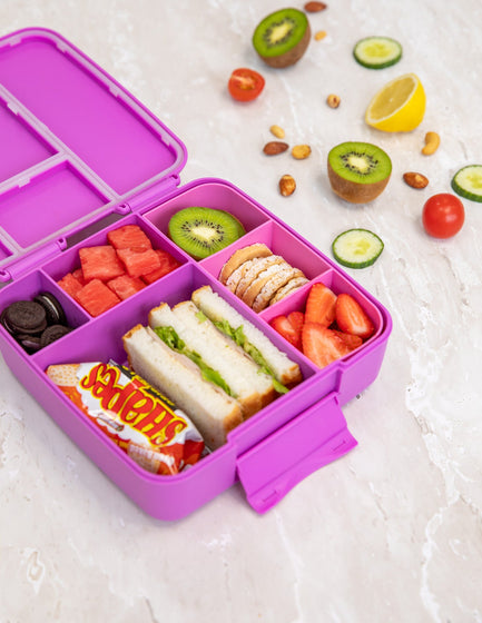 MontiiCo Feast Lunch Box - Fuchsia flatlay with snacks