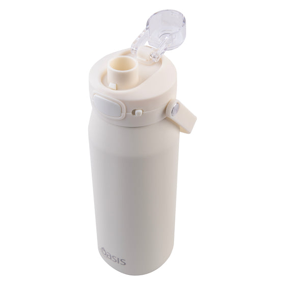 Oasis Ceramic Lined Stainless Steel Capri Drink Bottle 750ml cream bottle angled top view with open clear cap, pour spout and handle.