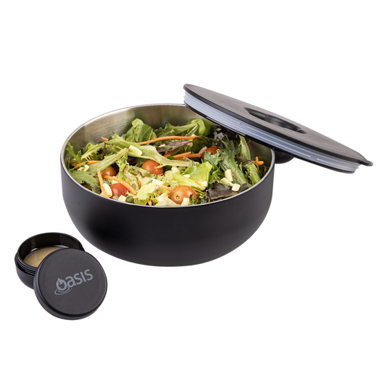 Oasis Black lunch bowl with a lid and a small container of dressing on a white background