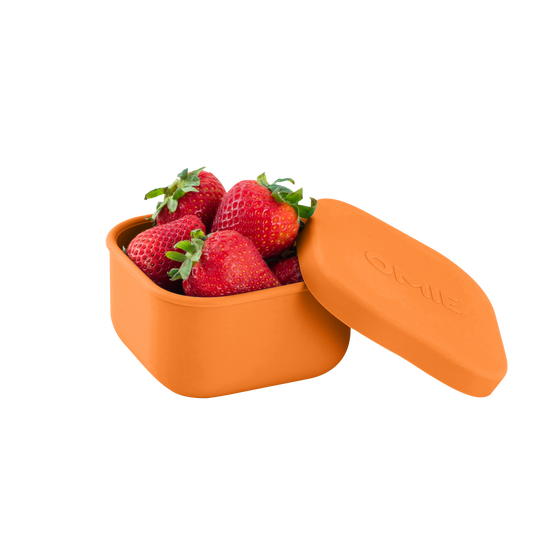 Omie snack silicone container orange colour with strawberries