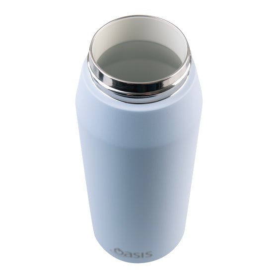 Oasis Ceramic Lined Stainless Steel Capri Drink Bottle 750ml powder blue open-mouth close-up showing ceramic interior, polished steel rim and smooth insulated body.